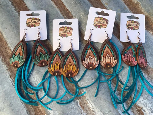 The Tad Hand Tooled Leather Earrings with Turquoise Border and Turquoise Deerskin Fringe The Rodeo Rose